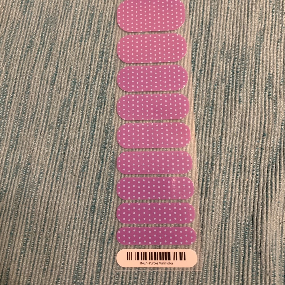Half sheet of Jamberry’s Purple Mini Polka wrap.
